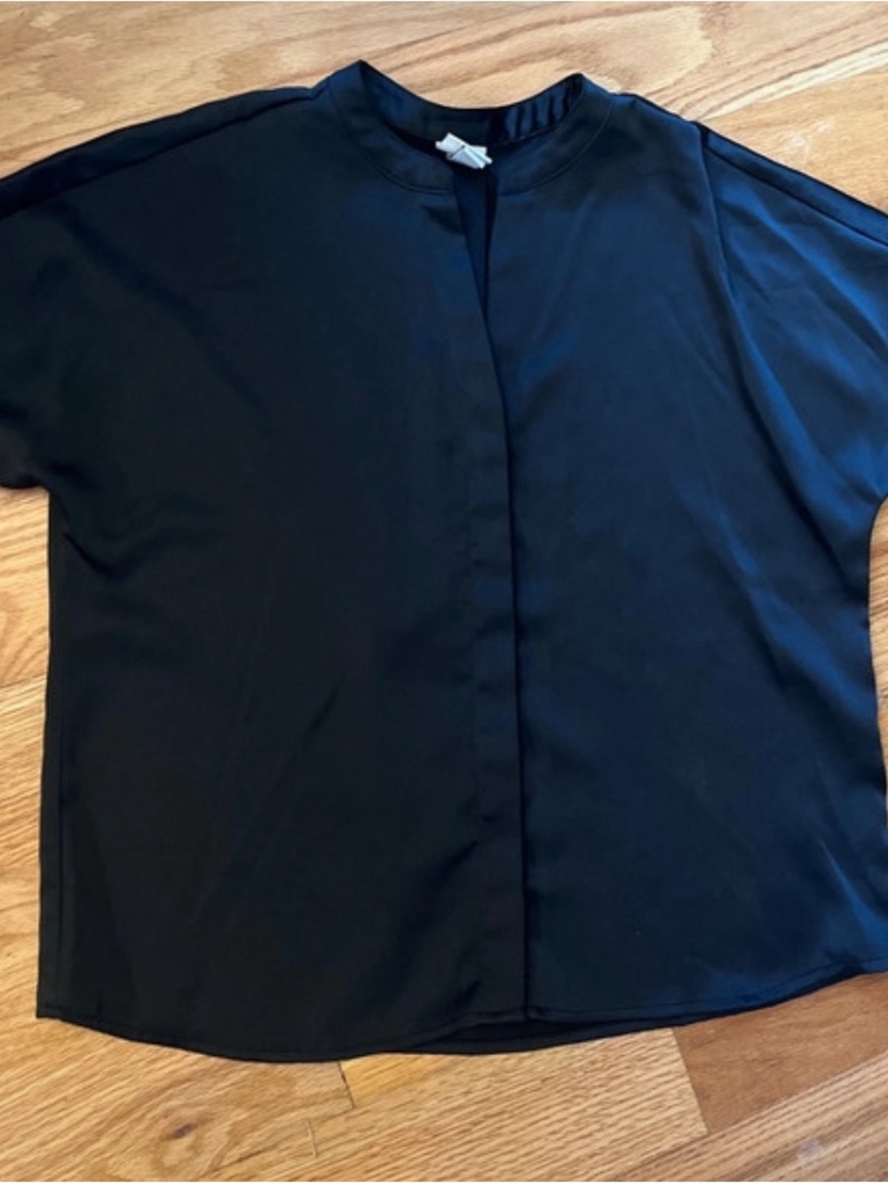 Black satin short sleeve hidden button front blouse